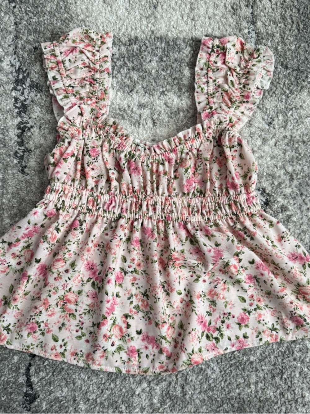 Evolutionary apparel peplum-style babydoll tank top
